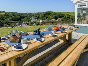 Locally made dining table and benches. Easily seats 12 for relaxed al fresco meals.