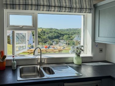 A great view when washing up. (P.S. There is also a dishwasher).
