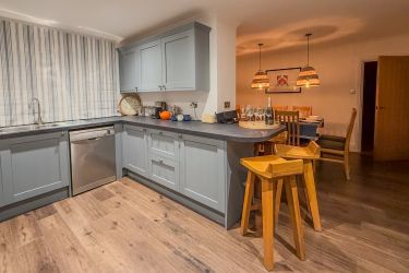 Sit at the bar with a cocktail and keep your chef company.