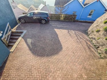 The driveway has ample space for 4-5 cars