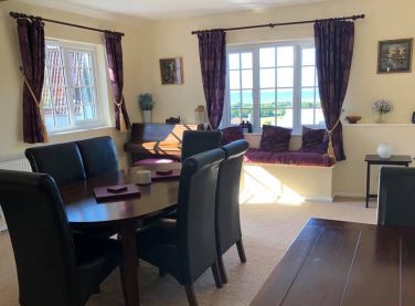 Extending dining table seats 8-10 guests.  Enjoy the sea views over Porlock Bay and Hurlstone Point