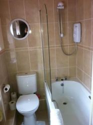 Ground floor bathroom with shower over the bath