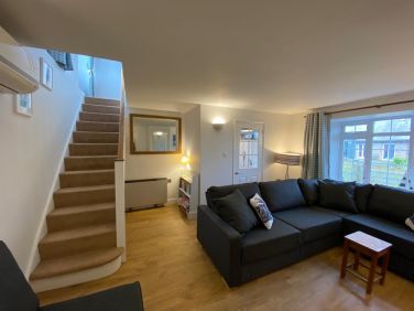 Lounge showing stairs up