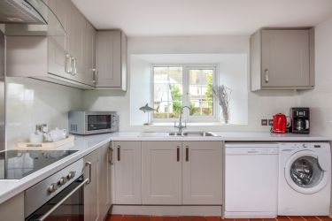 Kitchen with washing machine and dishwasher
