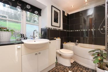 Family bathroom with over bath shower