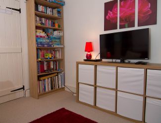 Snug/games room with CD & DVD players, and TV,  plus toys, books and games for all ages