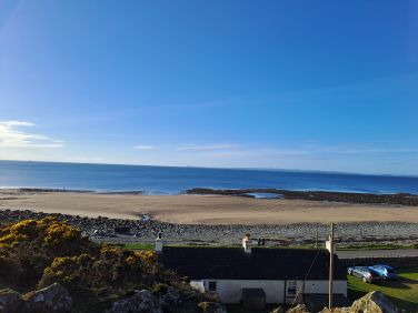 View from hill behind cottage at low tide