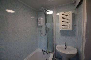Bathroom with hand basin, w/c, bath and shower