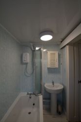 Small dressing area between bathroom and living room (not shown)