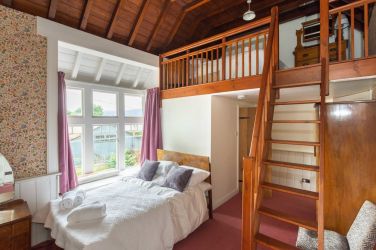 Bedroom 1 family bedroom showing the mezzanine floor up to a double cosy double bed