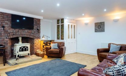 Cosy evenings with a wood burner reading room in Fairlea Grange