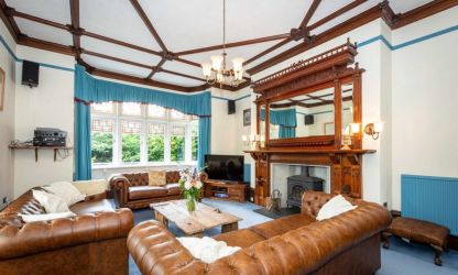 Leather Chesterfields, log burner and feature fire place at Fairlea Grange