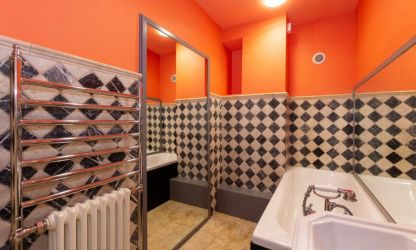 Over sized mirror and diamond patterned tiles at Fairlea Grange