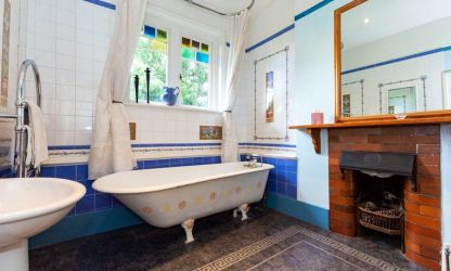 Roll top bath and traditional fire place feature in Fairlea Grange Abergavenny