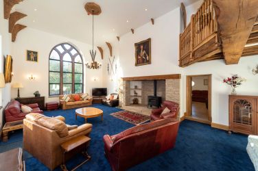 Oversized lounge with feature arch window The Manor on the Monnow Nr Monmouth