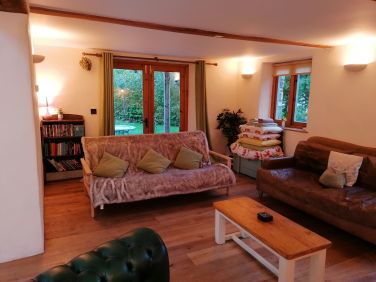 Open plan lounge with double sofa bed