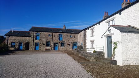 Farmhouse entrance ( White property) looking towards 4 adjoining properties