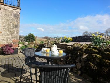 Patio outside Stoneyard cottageThe Coach