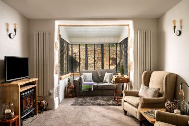 Beechtree cottage cosy lounge with bed sofa.