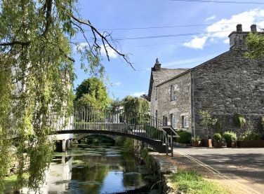 The River Eea quietly going through Cartmel