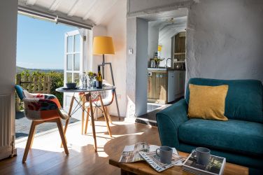 Living room 2: The Little Cottage, living space with dining area and log burner