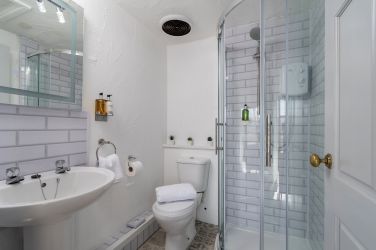 Bathroom 4: The Little Cottage, shower room with WC & sink