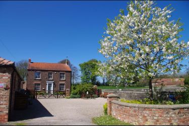 Village location with views over AONB (Area of Outstanding Natural Beauty).