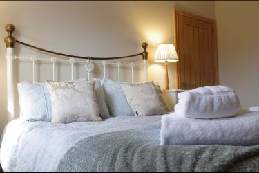 En-suite bedroom with Kingsize bed.