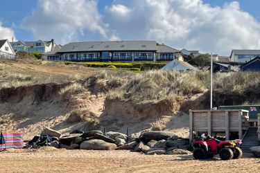 Looking back up at the building from the sandy beach
