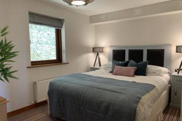 Cosy bedroom at the back of the building with King sized bed