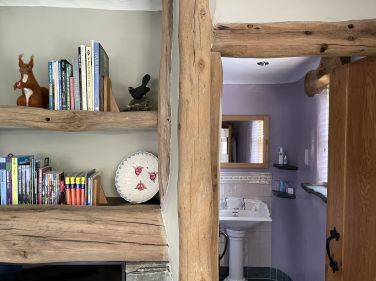 Guide books on the left, shower room through the door