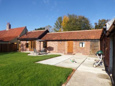 View of the cottage and enclosed garden before hot tub was installed.