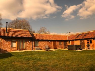 View of cottage once the hot tub had been installed.