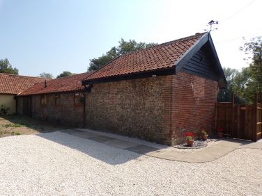 View as you drive in with your own parking in front of the cottage.