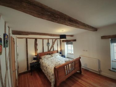 Bedroom 1 with King size bed and exposed beams