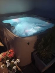 Hot tub on patio at night time perfect for star gazing.