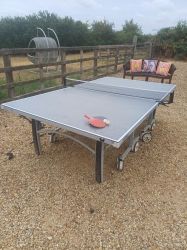 Table tennis in front of patio