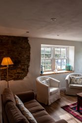 Lounge with exposed slate stones.