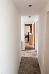 Tiled hallways, kitchen and bathroom, giving a cool continental feel.