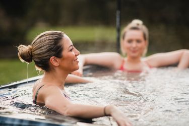 Soak in the hot tub with a glass of fizz, overlooking the lake  (NB over 12s only)