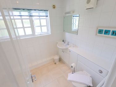 Family bathroom, with bath and shower over.