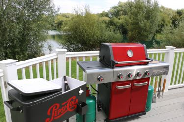 Gas barbecue and drinks cooler on the deck.