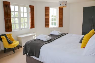 Master bedroom, with a Superking double bed. Lake views