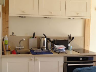 The kitchenette with two ring hob, oven and a small 45 litre fridge.