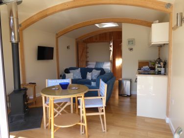 Interior of the studio with the wood burner and general area.