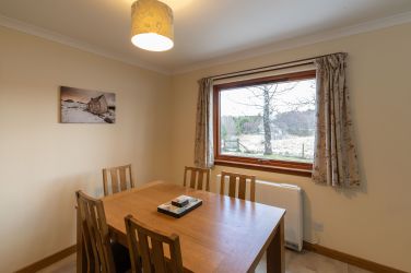 Dining area with field and mountain views