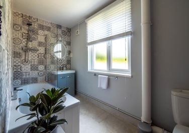 Bathroom featuring a hexagonal tile wall  Monnow Valley Studios Monmouthshire