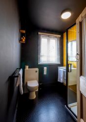 Striking black and yellow shower room Monnow Valley Studios Monmouthsire