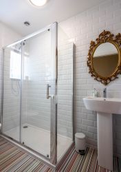 White Metro tiles a feature in a shower room Monnow Valley Studios Monmouthshire