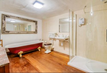 Roll top bath and walk in shower a bathroom in Monnow Valley Studios Monmouth